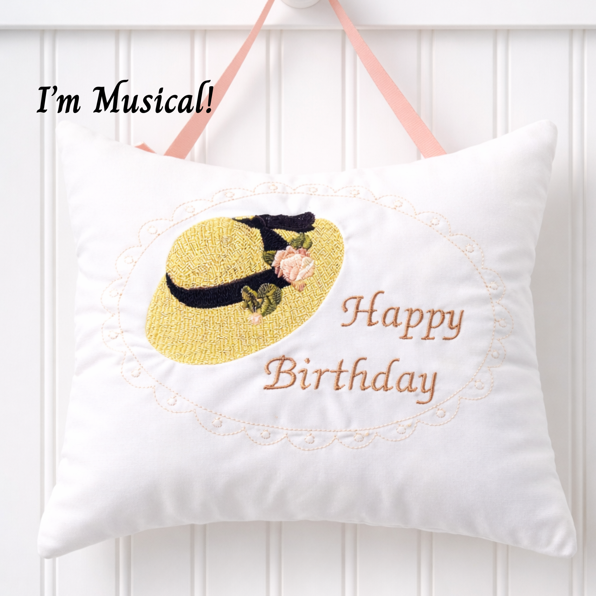 White music box pillow with a yellow hat design and 'Happy Birthday' text on a white background