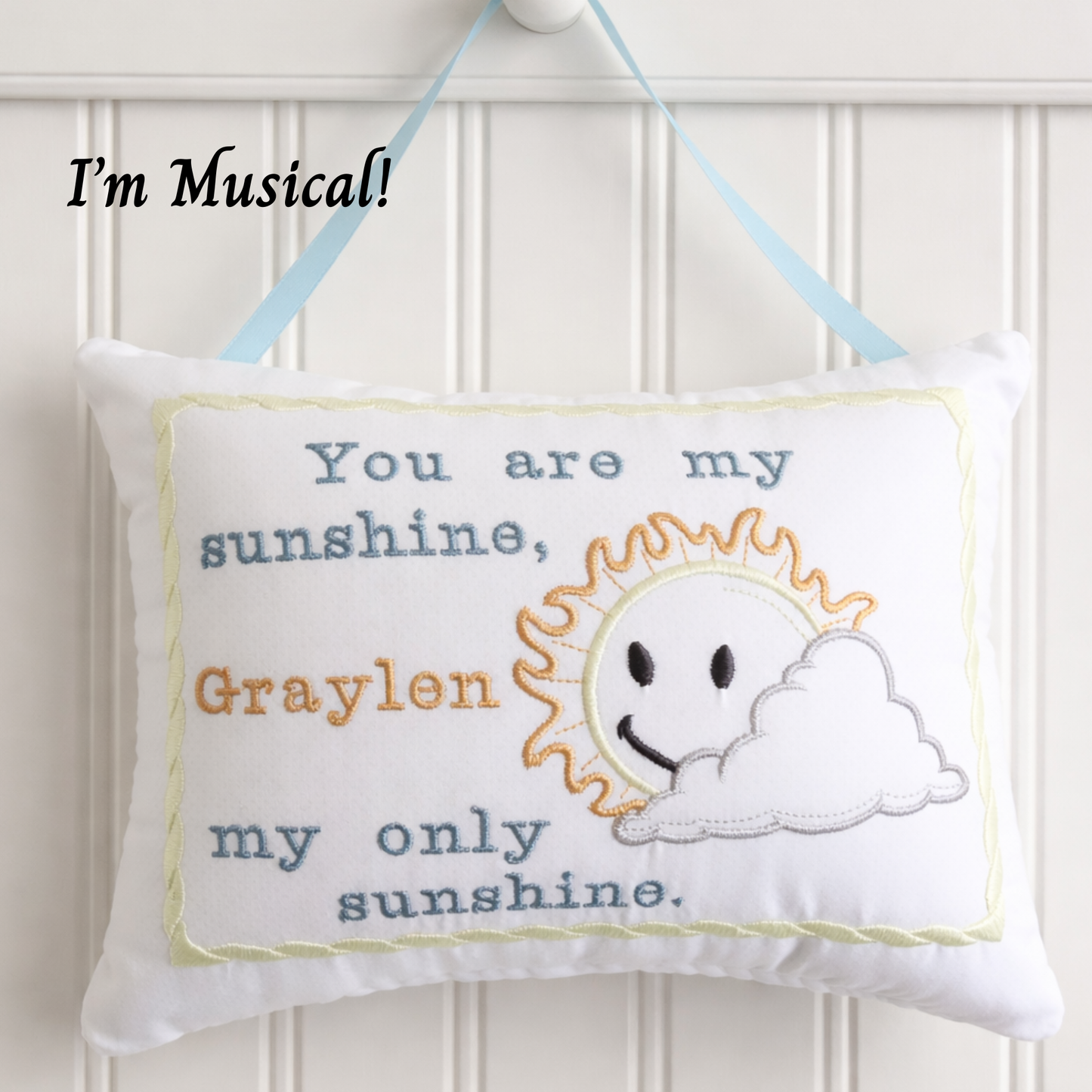 Decorativemusic box  pillow with sun and cloud design and text on a white background