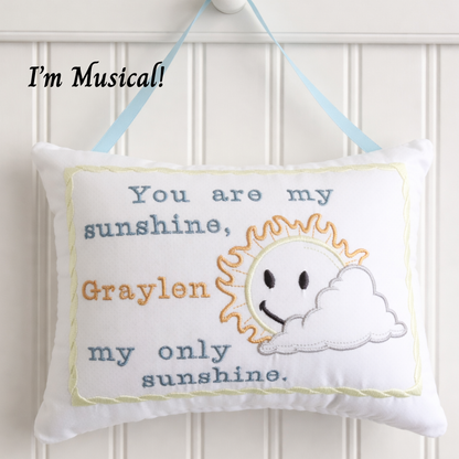 Decorativemusic box  pillow with sun and cloud design and text on a white background