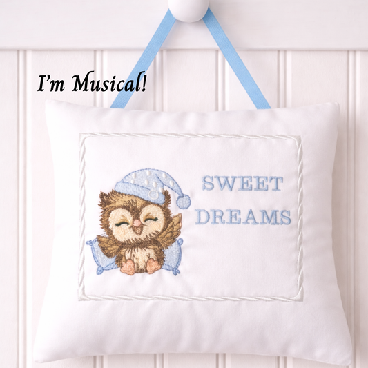 Decorative music box pillow with owl design and 'Sweet Dreams' text on a white background