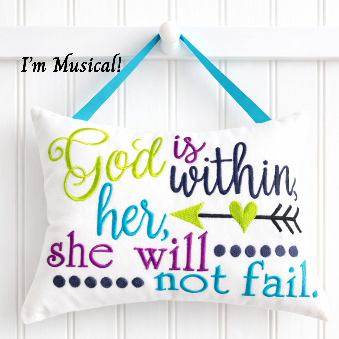 Decorative music box pillow with motivational quote on a white background