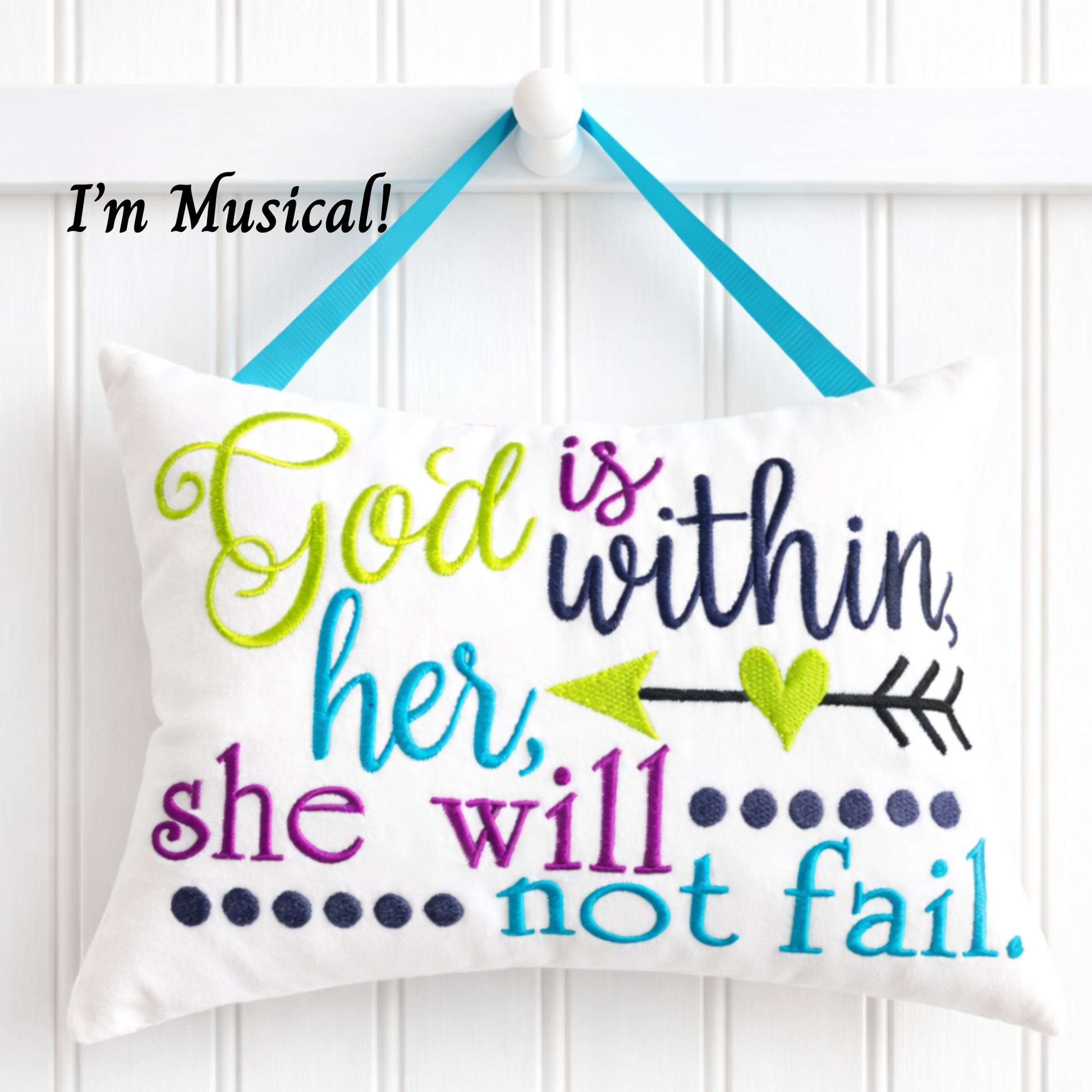 Decorative music box pillow with motivational quote on a white background