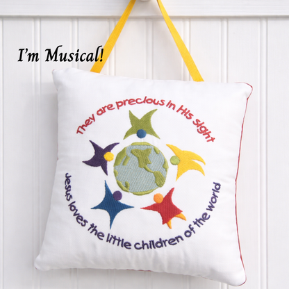 Decorative music box pillow with colorful stars and text on a white background