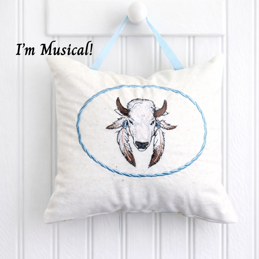 Decorative music box pillow with a bison design and 'I'm Musical!' text on a white background